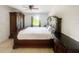 Comfortable bedroom featuring a large bed, dark furniture and a sunny window at 2336 Redfern St, Port Charlotte, FL 33948