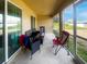 Relaxing screened porch area with comfortable seating and views of the backyard at 2336 Redfern St, Port Charlotte, FL 33948