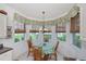 Bright breakfast nook with bay window, seating for four, and scenic views at 25511 Heritage Lake Blvd # 8, Punta Gorda, FL 33983