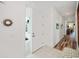 Bright and open entryway featuring tile flooring and hardwood floors, with a welcoming atmosphere at 25511 Heritage Lake Blvd # 8, Punta Gorda, FL 33983