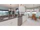 Kitchen features granite countertops, stainless appliances, and adjacent breakfast nook at 25511 Heritage Lake Blvd # 8, Punta Gorda, FL 33983