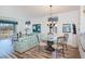 Bright living room with wood floors, a dining area, and views to the outside at 25511 Heritage Lake Blvd # 8, Punta Gorda, FL 33983