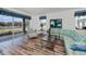 Bright living room featuring hardwood floors, comfortable furniture, and an abundance of natural light at 25511 Heritage Lake Blvd # 8, Punta Gorda, FL 33983