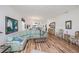 Open floor plan living room boasts wood floors and easy access to the kitchen at 25511 Heritage Lake Blvd # 8, Punta Gorda, FL 33983