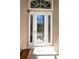Elegant front door featuring decorative glass panels and sidelights, complemented by a welcome mat at 26073 Feathersound Dr, Punta Gorda, FL 33955