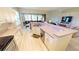 Open kitchen overlooking the living area, featuring modern appliances and plenty of counter space at 26073 Feathersound Dr, Punta Gorda, FL 33955