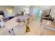 Well-equipped kitchen with stainless steel appliances, countertop seating, and ample counter space at 26073 Feathersound Dr, Punta Gorda, FL 33955