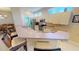 Modern kitchen with sleek appliances, breakfast bar, and ample cabinet space for storage at 26073 Feathersound Dr, Punta Gorda, FL 33955