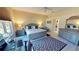 Bright main bedroom featuring a desk, large window, and en-suite bathroom at 26073 Feathersound Dr, Punta Gorda, FL 33955