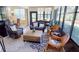 Cozy sunroom with comfortable seating, a patterned rug, and serene views of the backyard at 26073 Feathersound Dr, Punta Gorda, FL 33955