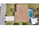 Aerial view featuring the home's roof, an enclosed pool area, and adjacent structures at 3080 Saint James St, Port Charlotte, FL 33952