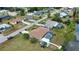 Aerial view of a community with canal access, mature trees, and serene neighborhood streets and homes at 3080 Saint James St, Port Charlotte, FL 33952