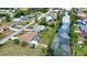 This aerial view of the community shows the waterfront homes, mature trees, and neighborhood streets at 3080 Saint James St, Port Charlotte, FL 33952