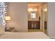 This bathroom features tile floors, wood vanity, and a large mirror with vanity lighting at 3080 Saint James St, Port Charlotte, FL 33952