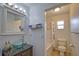 This bathroom features modern fixtures, including a vessel sink, and a tub with a shower at 3080 Saint James St, Port Charlotte, FL 33952