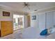 Comfortable bedroom with a view to the lanai, ample closet space, and neutral colors, promoting restfulness at 3080 Saint James St, Port Charlotte, FL 33952
