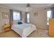 Cozy bedroom with tile floors, bright windows, and neutral tones, offering a relaxing retreat at 3080 Saint James St, Port Charlotte, FL 33952