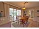 Bright dining area with a view of the pool and easy access to the adjacent rooms at 3080 Saint James St, Port Charlotte, FL 33952