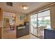 This kitchen offers an open-concept design and a view of the patio and pool area at 3080 Saint James St, Port Charlotte, FL 33952