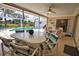 This screened lanai features an outdoor dining area and a pool view, perfect for entertainment and relaxation at 3080 Saint James St, Port Charlotte, FL 33952
