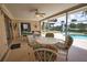 The screened lanai offers an outdoor seating area and a pool view, creating a delightful spot for entertaining at 3080 Saint James St, Port Charlotte, FL 33952
