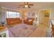 Spacious living room with multiple seating options and natural light, connecting seamlessly to other areas at 3080 Saint James St, Port Charlotte, FL 33952