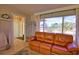 Comfortable living room with a large window offering natural light and outdoor views at 3080 Saint James St, Port Charlotte, FL 33952
