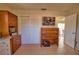 The office space showcases an area with tiled floors, a closet, and wood furniture providing ample storage at 3080 Saint James St, Port Charlotte, FL 33952