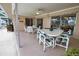 Enclosed patio with tile flooring, ceiling fan, and patio furniture, perfect for outdoor dining and relaxation at 3080 Saint James St, Port Charlotte, FL 33952