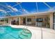 Enjoy the outdoors in this screened in pool and lanai area with tile flooring and plenty of space for entertaining at 3080 Saint James St, Port Charlotte, FL 33952