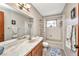 Bathroom with a tub and shower combination, a large mirror, and vanity, designed for functionality and style at 3663 Sterling Rd, Venice, FL 34293