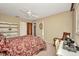 Bedroom with a canopy bed, sewing table and chair, and closet, combining relaxation with creative space at 3663 Sterling Rd, Venice, FL 34293