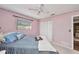 Comfortable bedroom with a ceiling fan, a window, and a closet, providing a relaxing retreat at 3663 Sterling Rd, Venice, FL 34293