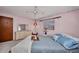 Tranquil bedroom featuring soft lighting, a large bed, and classic decor at 3663 Sterling Rd, Venice, FL 34293
