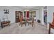 Dining area with wooden table set and hutch near sliding glass doors at 3663 Sterling Rd, Venice, FL 34293