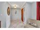 Bright foyer with tile flooring and decorative mirror at 3663 Sterling Rd, Venice, FL 34293