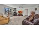 Cozy living room featuring plush seating, fireplace, and plenty of natural light at 3663 Sterling Rd, Venice, FL 34293