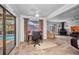 Inviting living area with plush carpeting, fireplace, and a view of the pool area at 3663 Sterling Rd, Venice, FL 34293