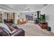 Bright open floor plan with a fireplace, large windows, and living area at 3663 Sterling Rd, Venice, FL 34293