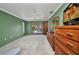 View of main bedroom with a ceiling fan, carpeted floor, dresser, and sliding doors to the pool area at 3663 Sterling Rd, Venice, FL 34293