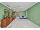 Bright and airy main bedroom featuring a ceiling fan, carpeted floor, and ample space for relaxation at 3663 Sterling Rd, Venice, FL 34293