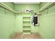 Walk-in closet with shelving units and hanging rods, providing plenty of storage space at 3663 Sterling Rd, Venice, FL 34293