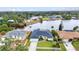 Waterfront home with backyard access to a canal, enhanced by lush greenery, and showcasing its prime waterfront location at 474 Lomond Dr, Port Charlotte, FL 33953