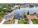 Beautiful waterfront property with direct canal access, surrounded by lush landscaping, offering a serene and picturesque setting at 474 Lomond Dr, Port Charlotte, FL 33953