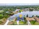 An aerial shot of waterfront houses with boat docks and meticulously cared-for landscapes alongside the canal at 474 Lomond Dr, Port Charlotte, FL 33953