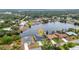 Waterfront homes in an aerial view feature backyard boat docks and lovely manicured landscaping at 474 Lomond Dr, Port Charlotte, FL 33953