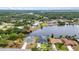 This is an aerial view showing waterfront houses with their own private boat docks on the canal at 474 Lomond Dr, Port Charlotte, FL 33953