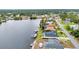 Waterfront properties with serene canal views, lush greenery, and a peaceful residential setting at 474 Lomond Dr, Port Charlotte, FL 33953