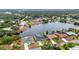 Beautiful aerial view of waterfront homes along a large canal with mature landscaping and private docks at 474 Lomond Dr, Port Charlotte, FL 33953