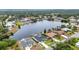 Scenic aerial view of waterfront homes along a large canal with mature landscaping and private docks at 474 Lomond Dr, Port Charlotte, FL 33953